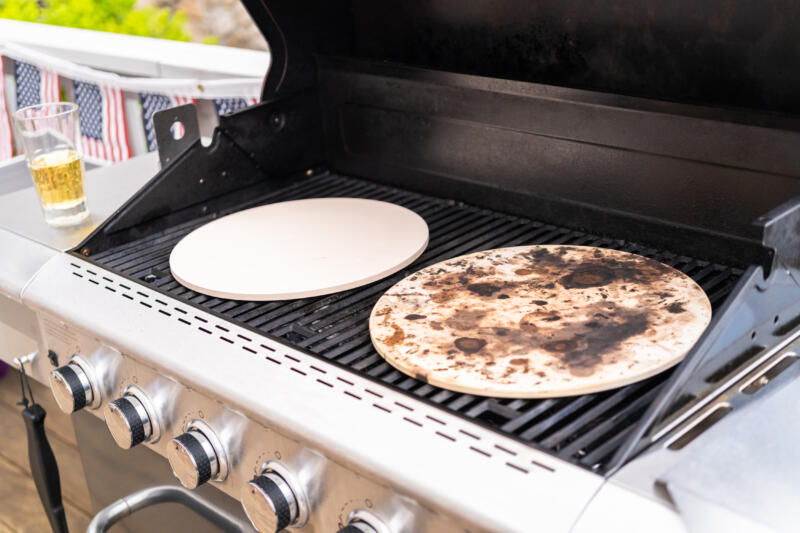 Preheating two different pizza stones on outdoor bbq grill