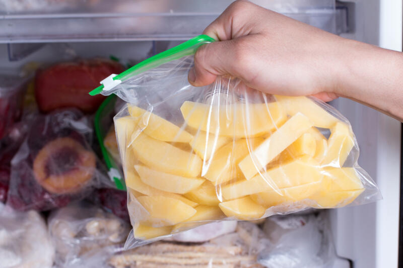 Frozen potatoes in a bag in the freezer