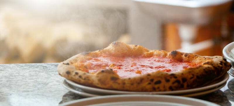 Neapolitan, pizza with only tomato without mozzarella.