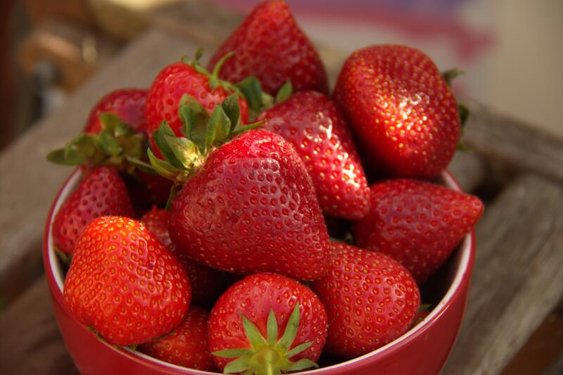 A bowl of red fresh strawberries