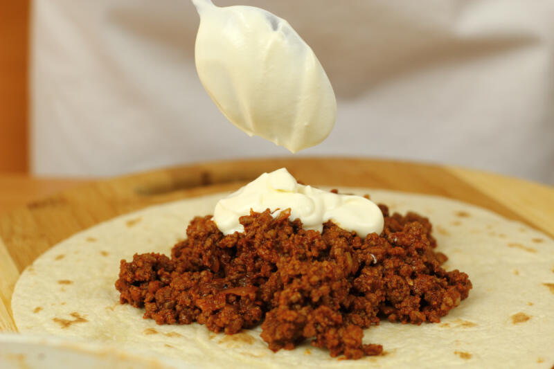 Adding a tablespoon of sour cream to the ground beef