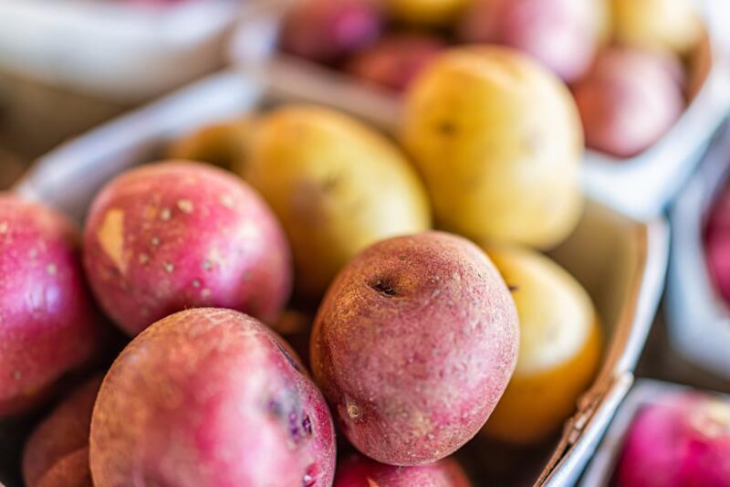 Different kinds of whole potatoes close-up