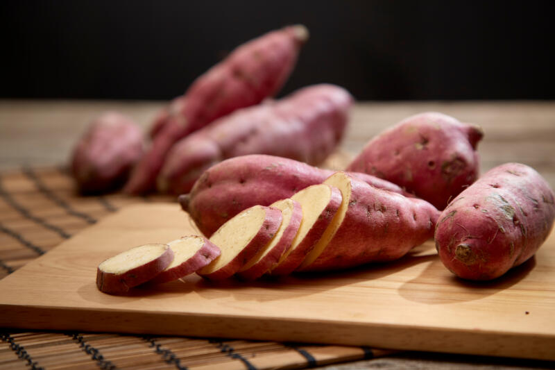Several sweet potatoes on a table