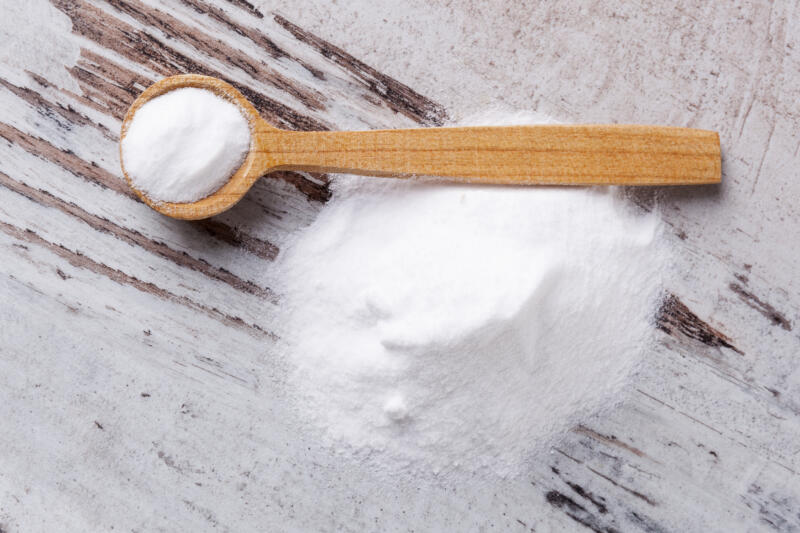 Baking soda in a wooden spoon