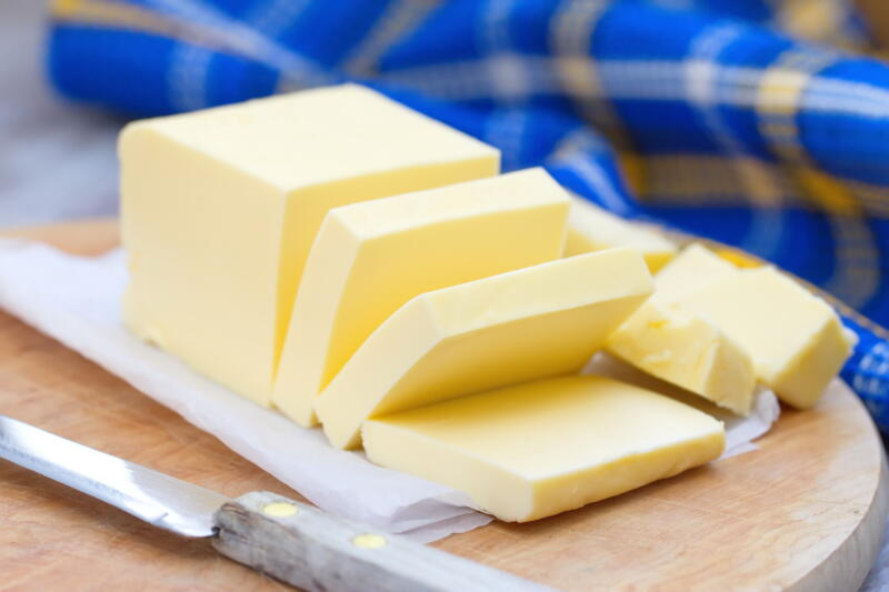 Fresh sliced butter on a cutting board