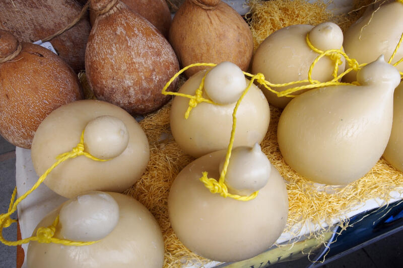 Caciocavallo cheese, top view of a stand on a local street market