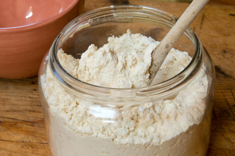 Gluten-free flour for baking, in an old jar with spoon