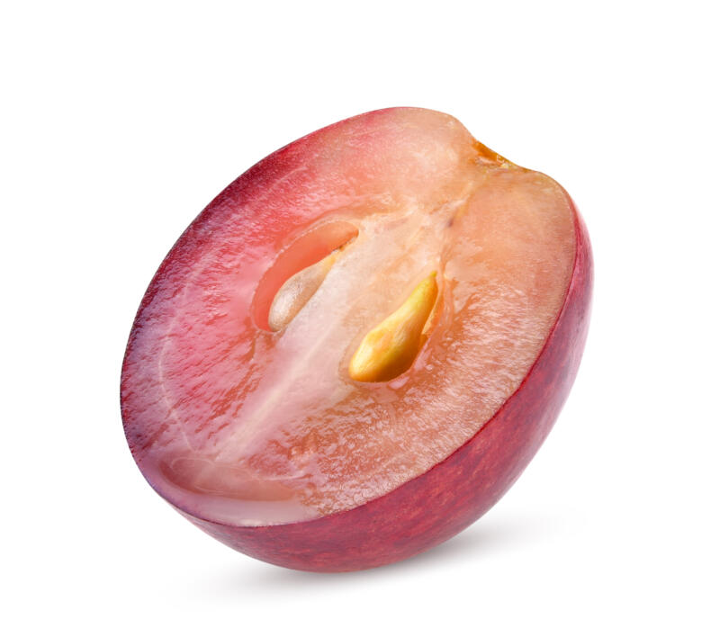 Sliced red grape on a white background