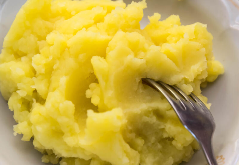 Fluffy mashed potatoes and a fork