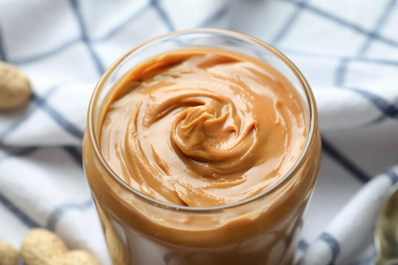 A jar of a creamy peanut butter