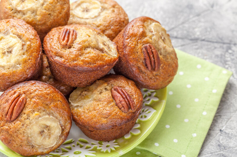 Pecan banana cup cakes on a green plate