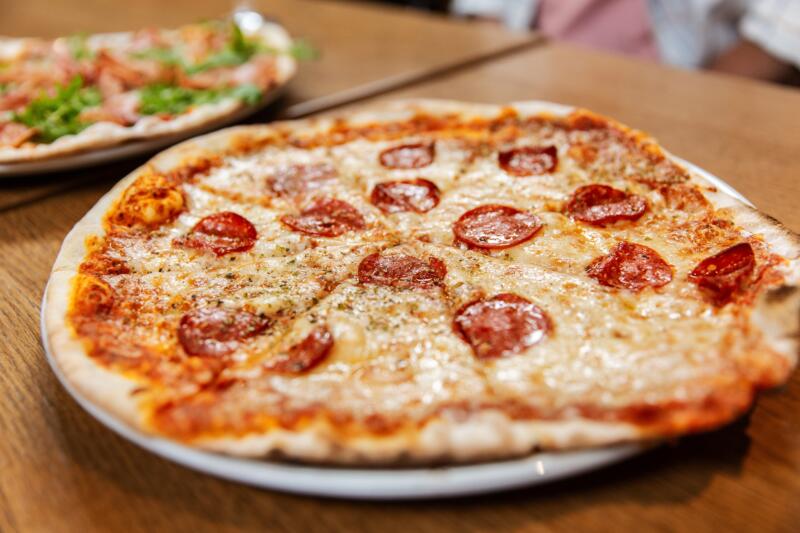 Sliced pepperoni pizza served on a plate