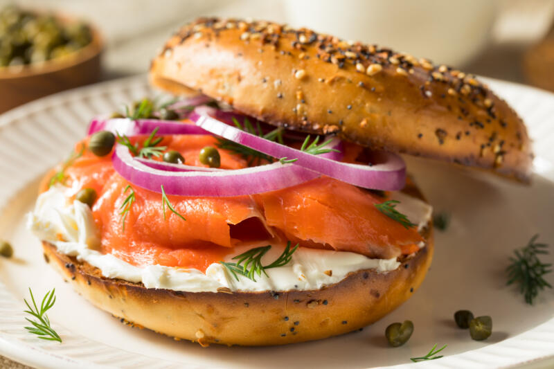 Cream cheese and salmon bagel on a plate ready to be served