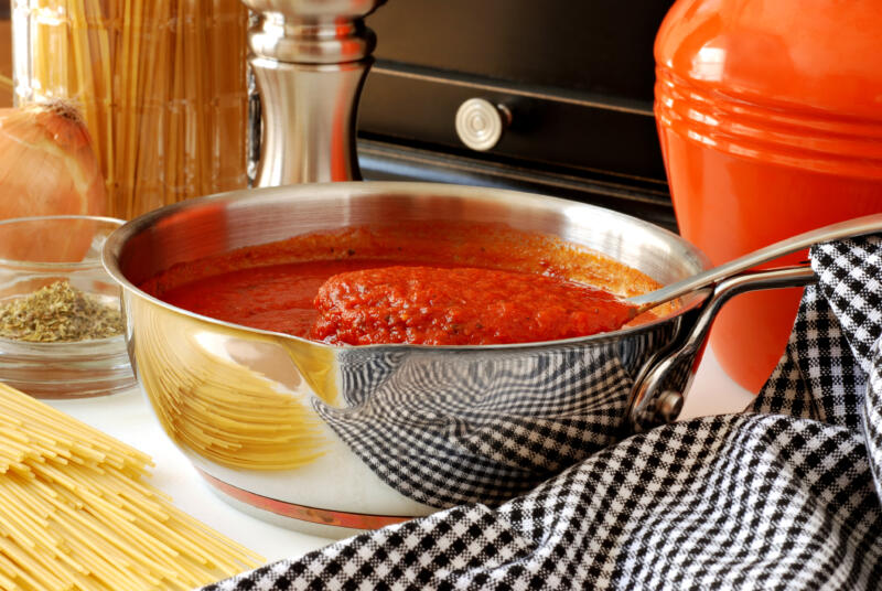Prepared tomato sauce in a pan on a kitchen table