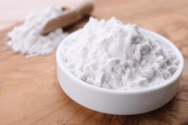 A small bowl of baking soda on the table