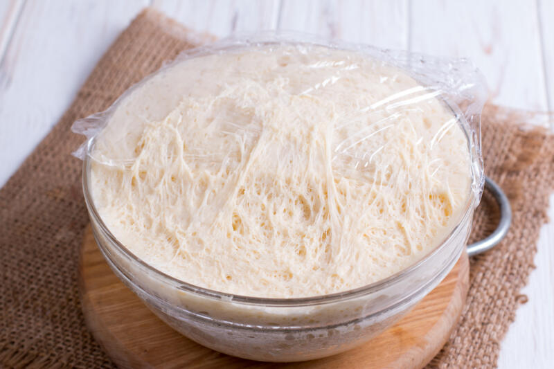 Fresh yeast dough for pizza in a bowl