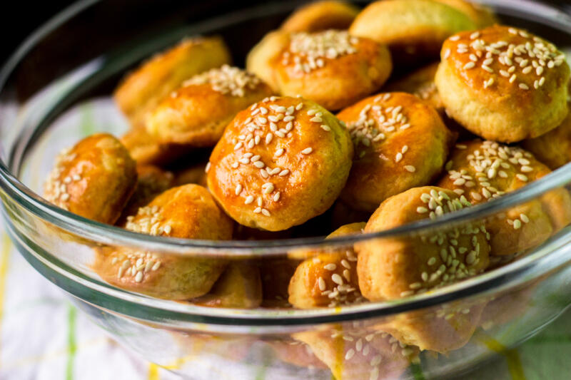 Golden buttermilk biscuits in a transparent bowl