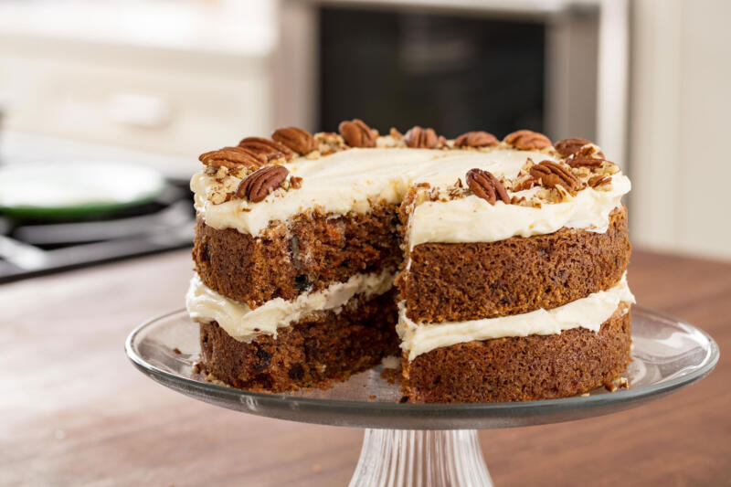 Frosted carrot cake on a serving plate