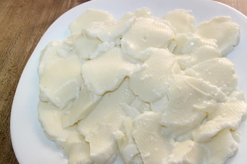 Sliced mozzarella on a white plate