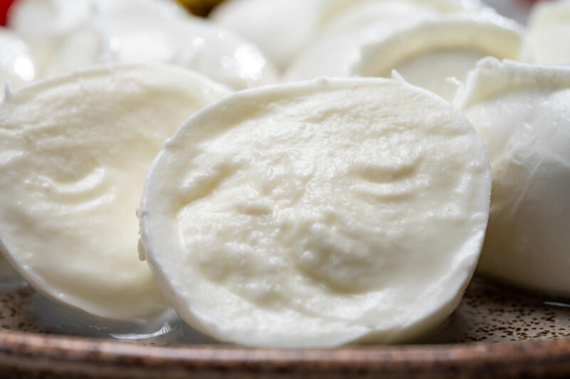 Many Mozzarella di Bufala balls on a plate close-up