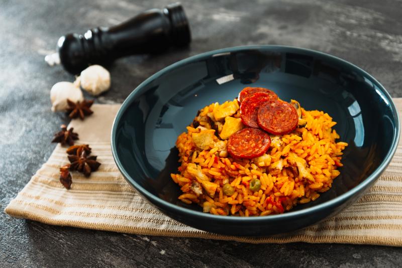 Paella with chicken, seafood and chorizo in a plate