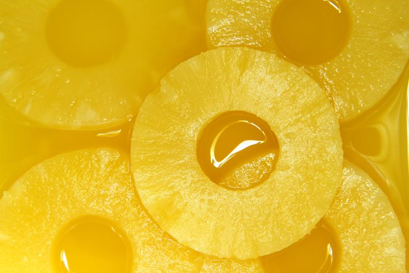 Closeup of pineapple slices in natural juice